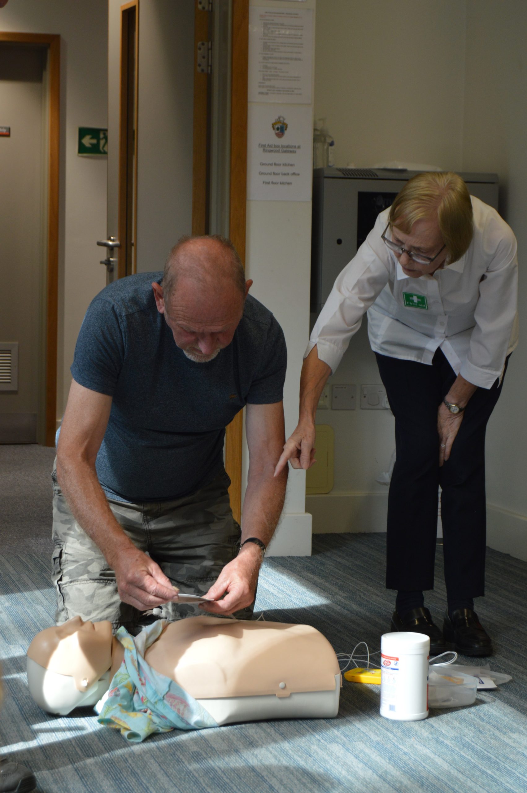 Alison First Aid Trainer directing a delegate where to place the pads for AED, during a First aid at work course with New Forest First Aid Training.