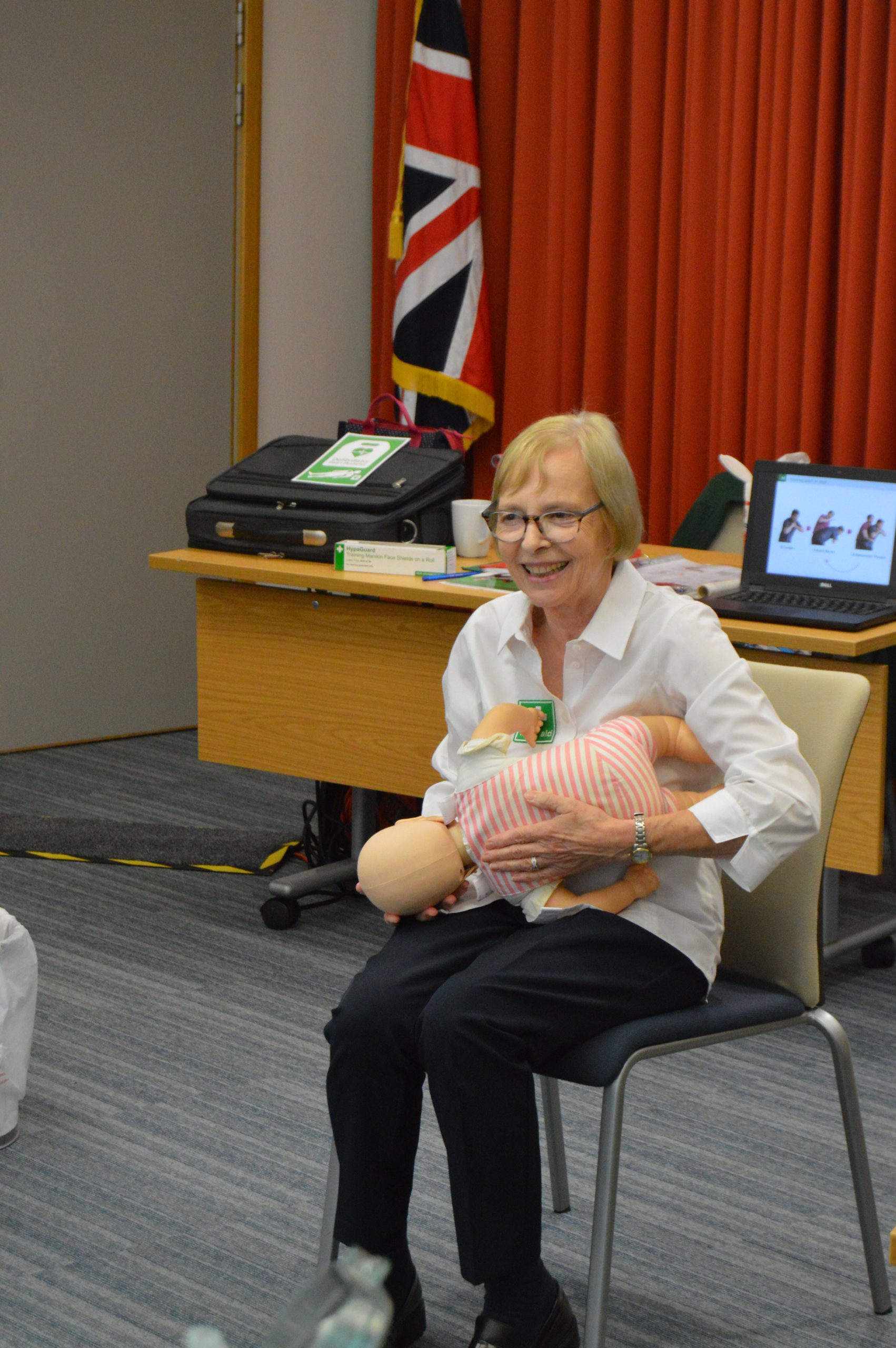 Alison First Aid Trainer demonstrating back blows to a baby choking